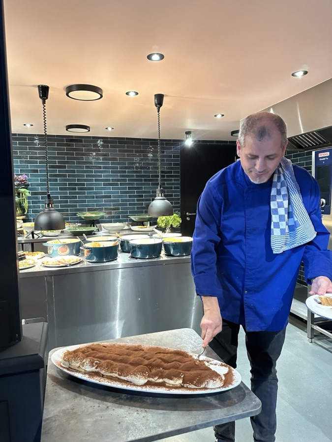 The tiramisu, cut and served in the room.
