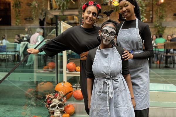 The team in costume for the Halloween brunch.